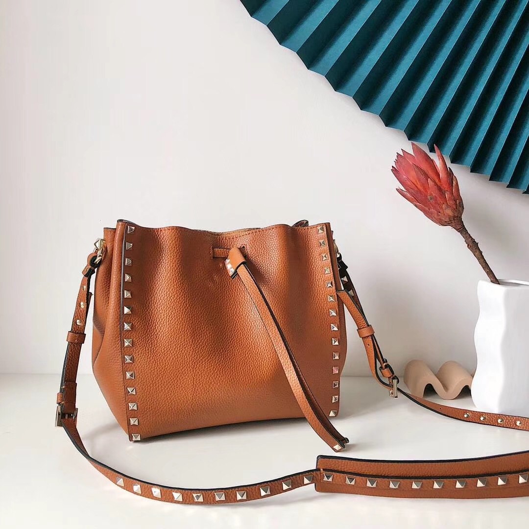 Va1e*ntin0 small rockstud bucket bag in brown calfskin