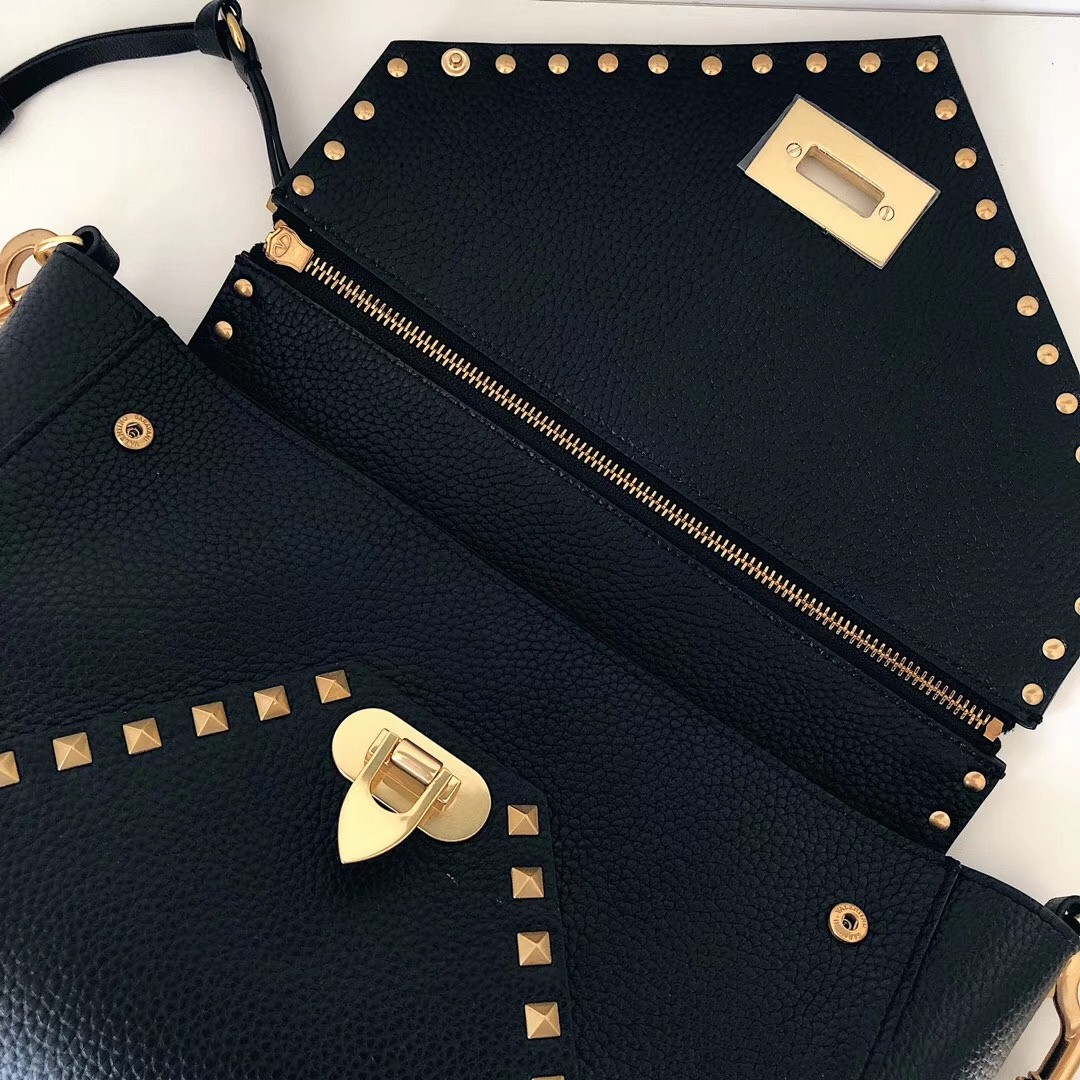 Va1e*ntin0 rockstud hype bag in black grained calfskin