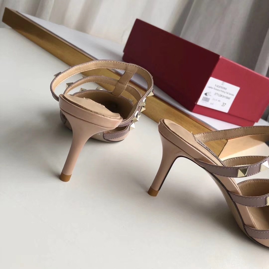 Va1e*ntin0 rockstud mules 50mm in nude patent leather