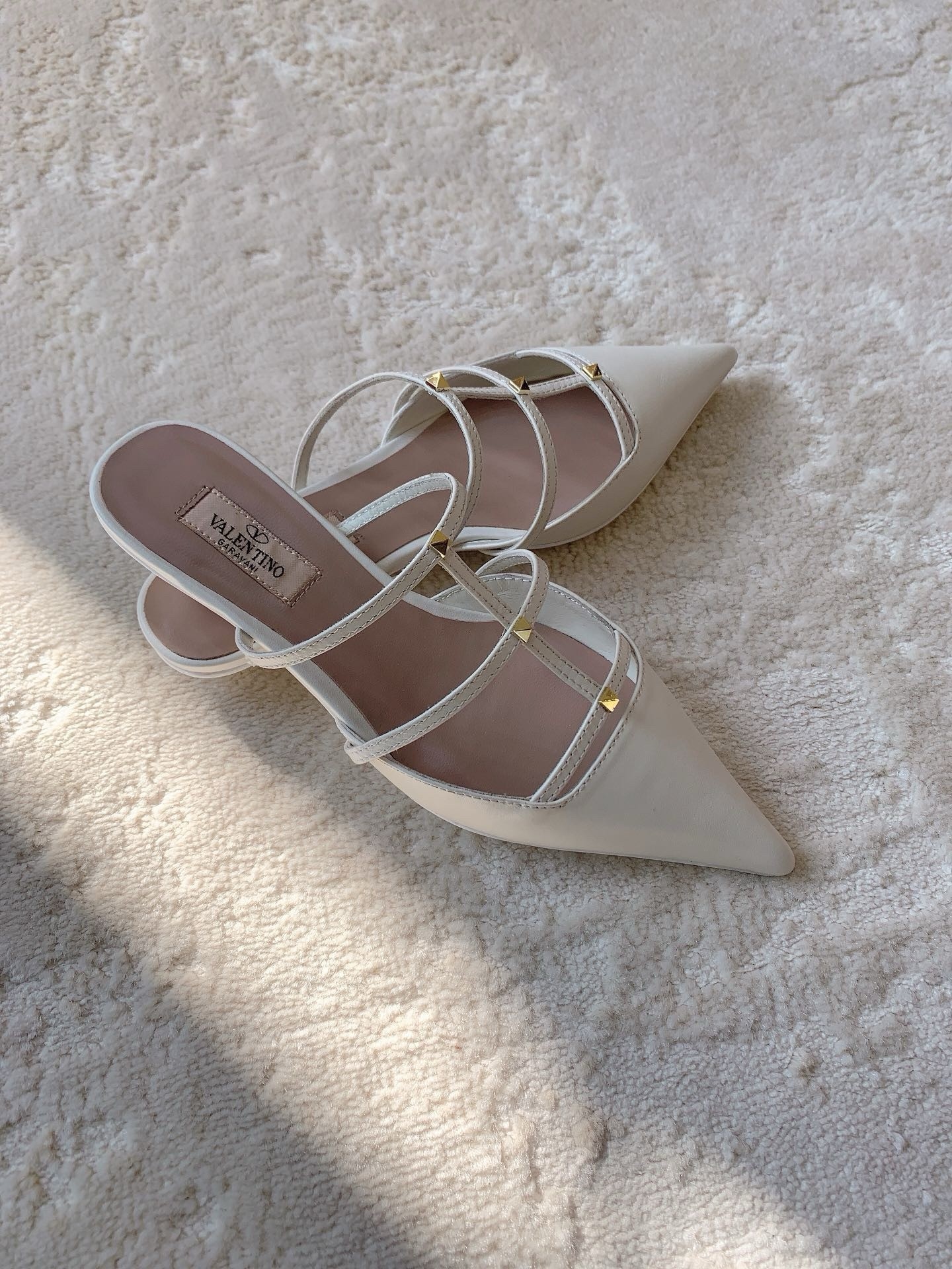 Va1e*ntin0 rockstud wispy mules in white leather
