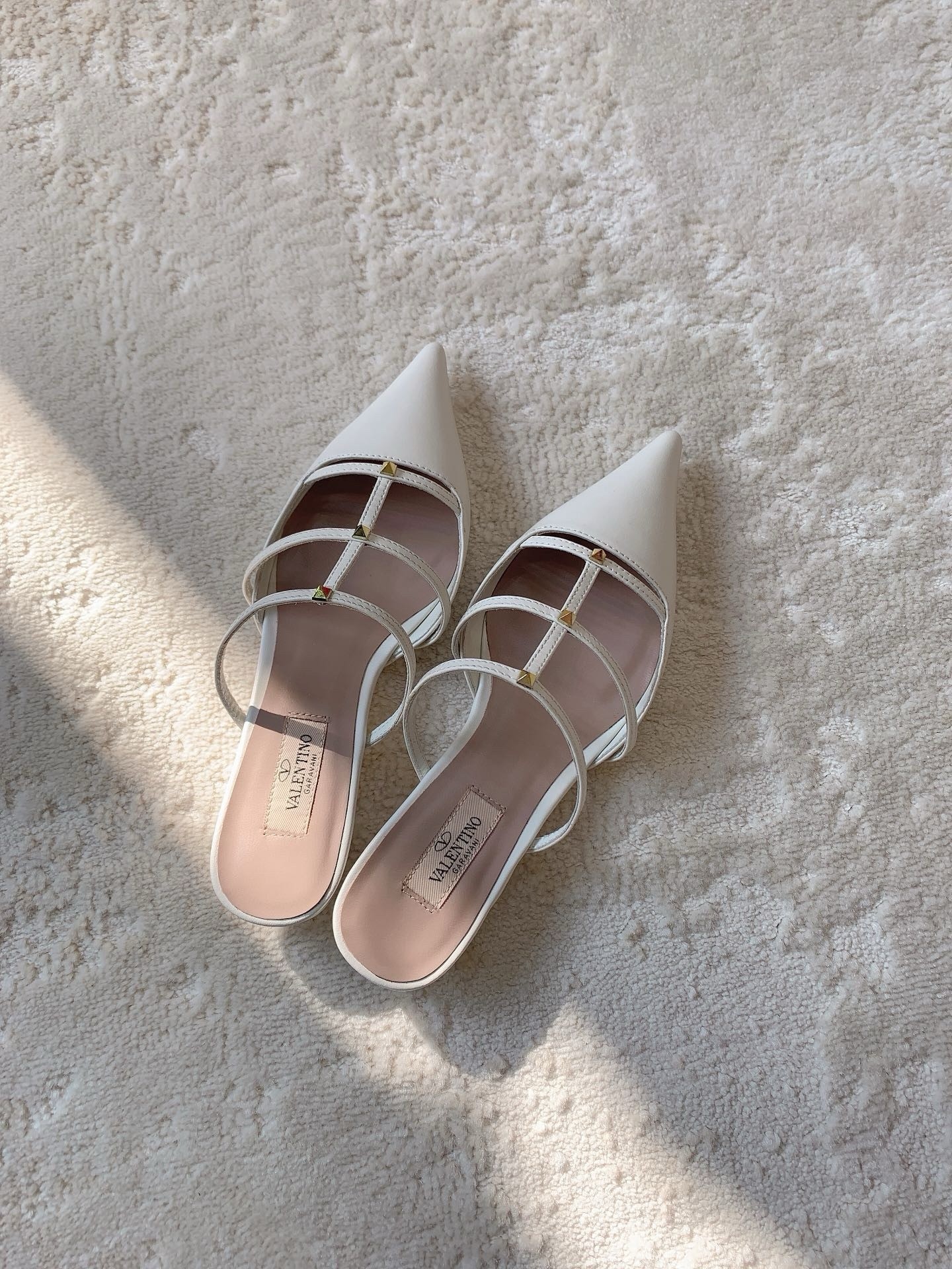 Va1e*ntin0 rockstud wispy mules in white leather
