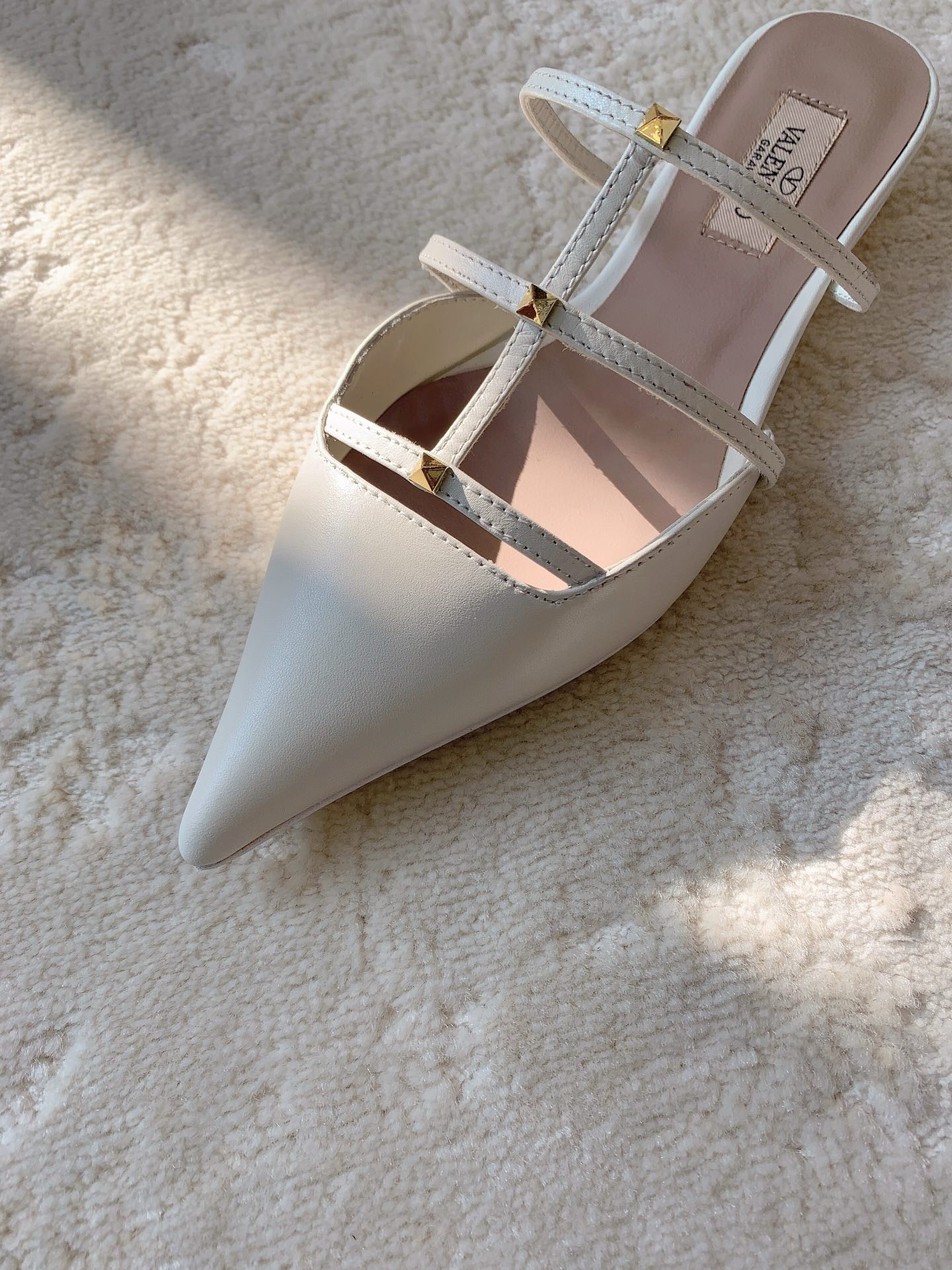Va1e*ntin0 rockstud wispy mules in white leather
