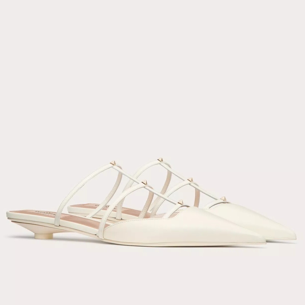 Va1e*ntin0 rockstud wispy mules in white leather