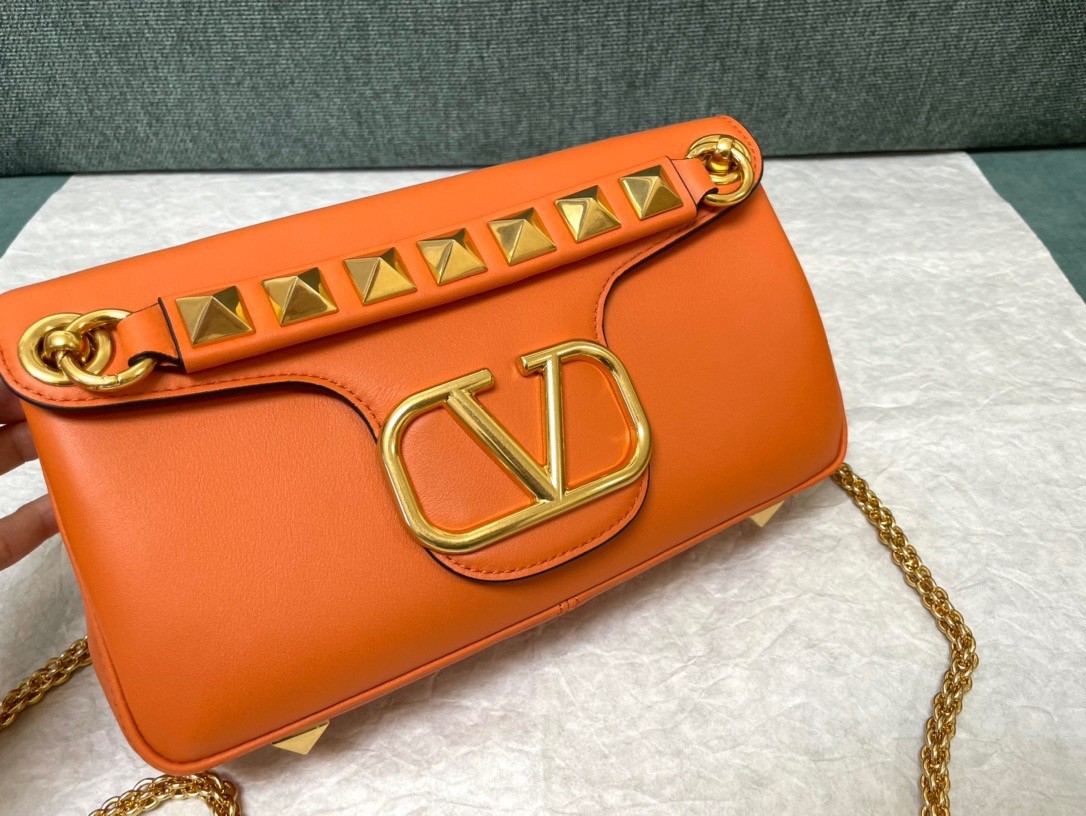Va1e*ntin0 stud sign shoulder bag in orange nappa leather