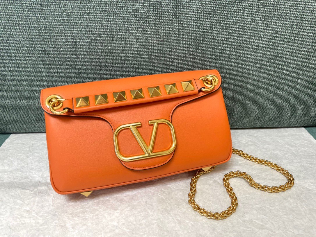 Va1e*ntin0 stud sign shoulder bag in orange nappa leather
