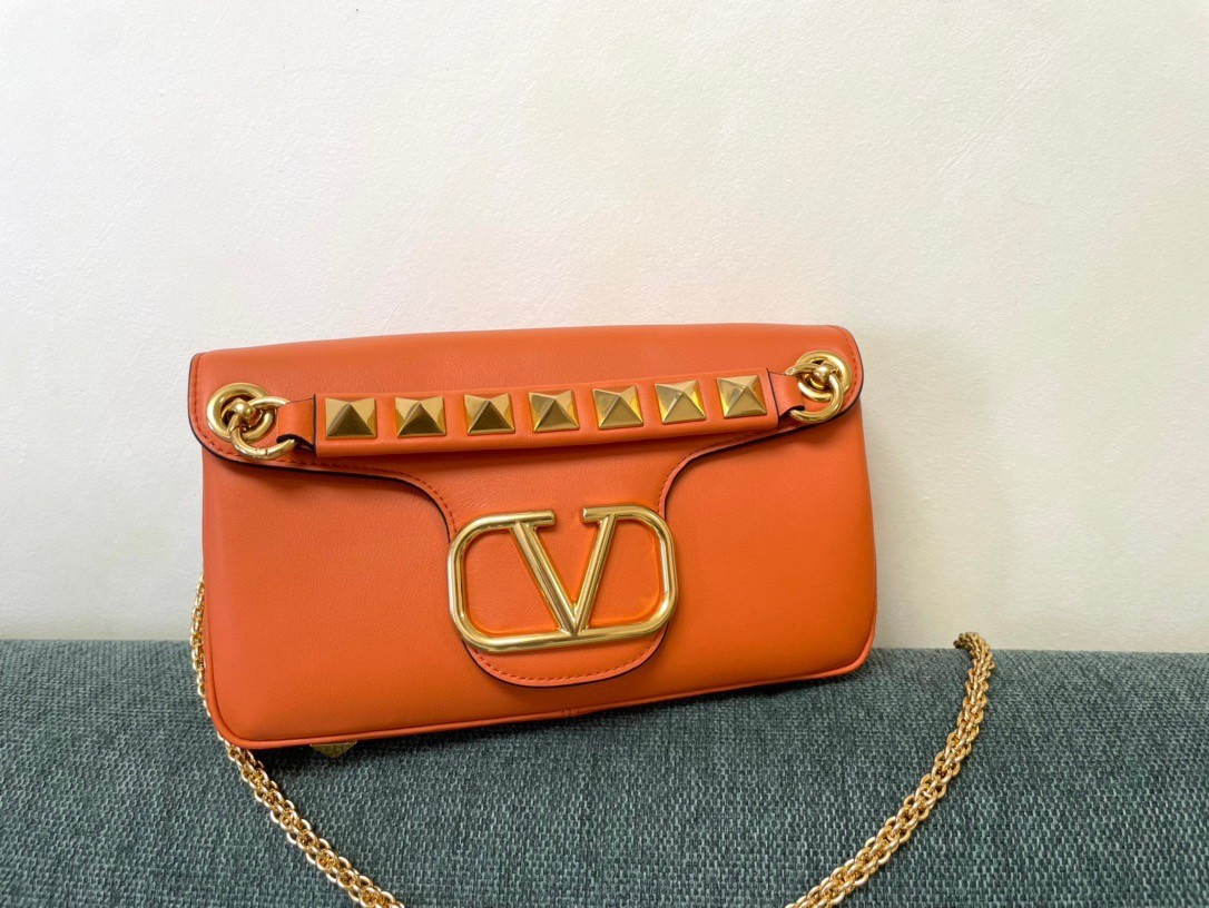 Va1e*ntin0 stud sign shoulder bag in orange nappa leather