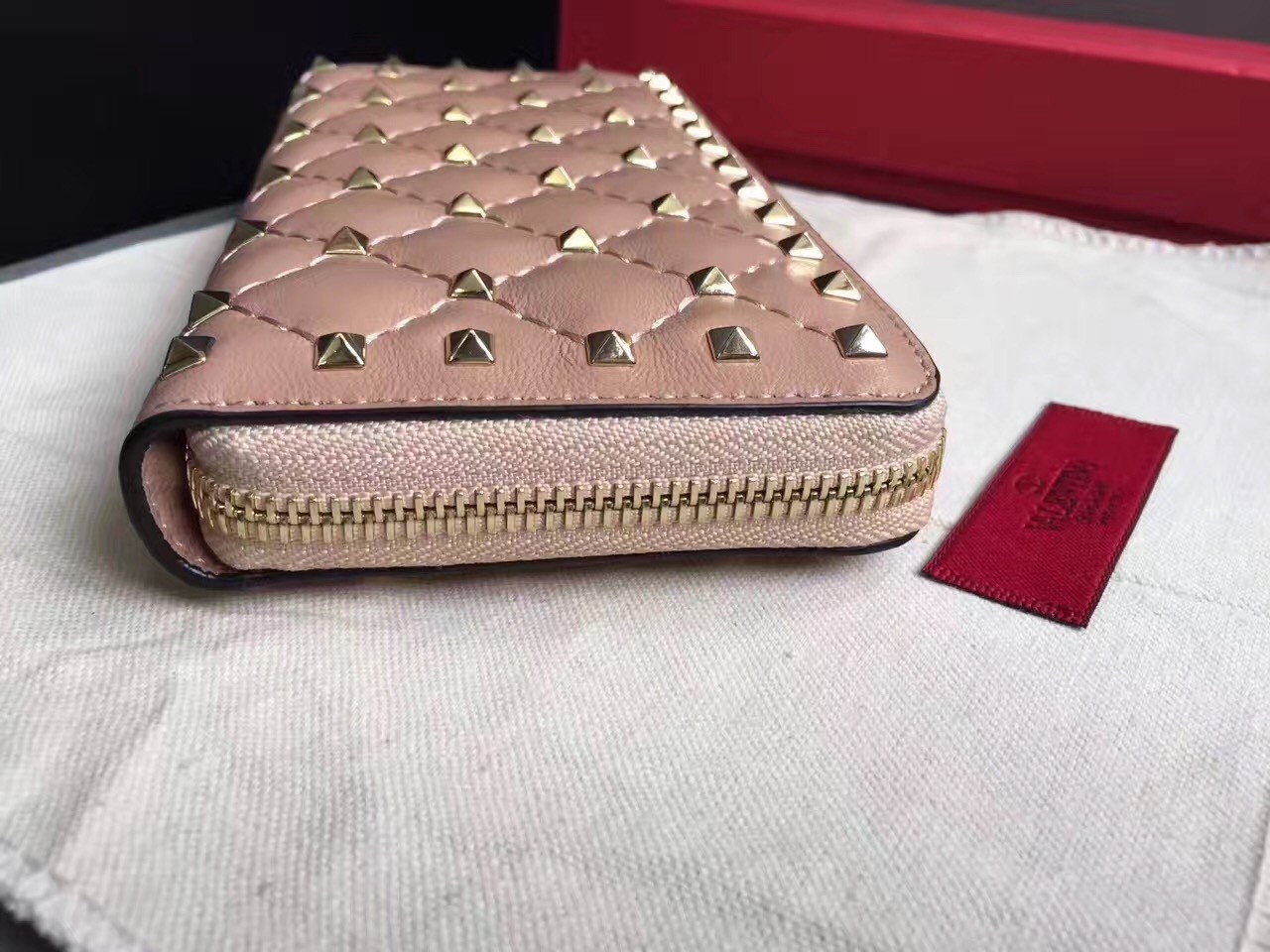 Va1e*ntin0 rockstud spike zip wallet in pastel pink lambskin