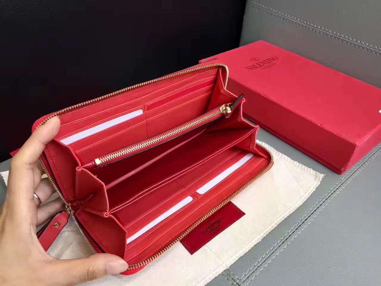 Va1e*ntin0 rockstud spike zip wallet in red lambskin