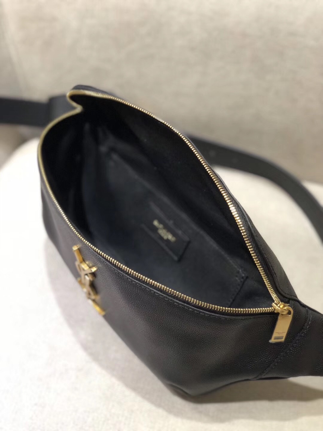 Sa**t Lau*nt classic monogram belt bag in black grained leather