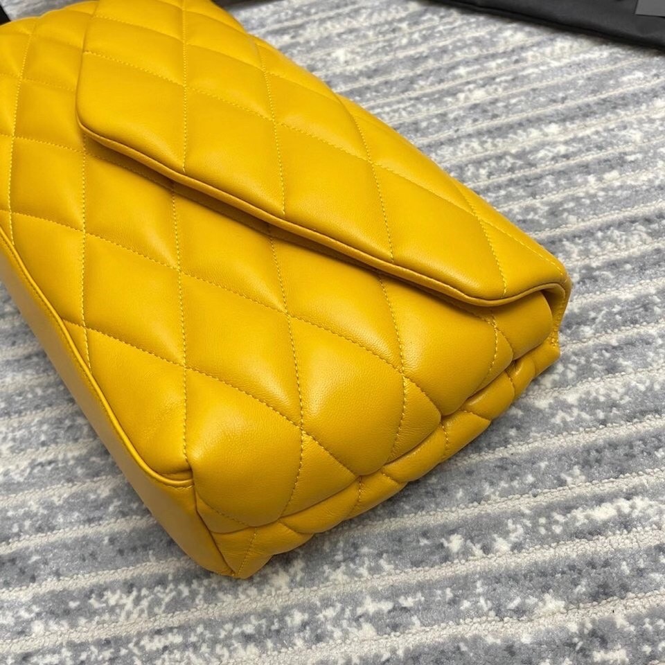 Sa**t Lau*nt sade puffer envelope clutch in yellow lambskin