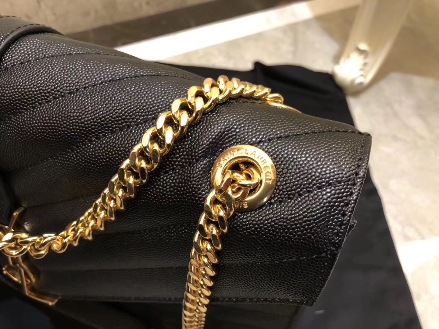 Sa**t Lau*nt envelope large bag in black quilted leather