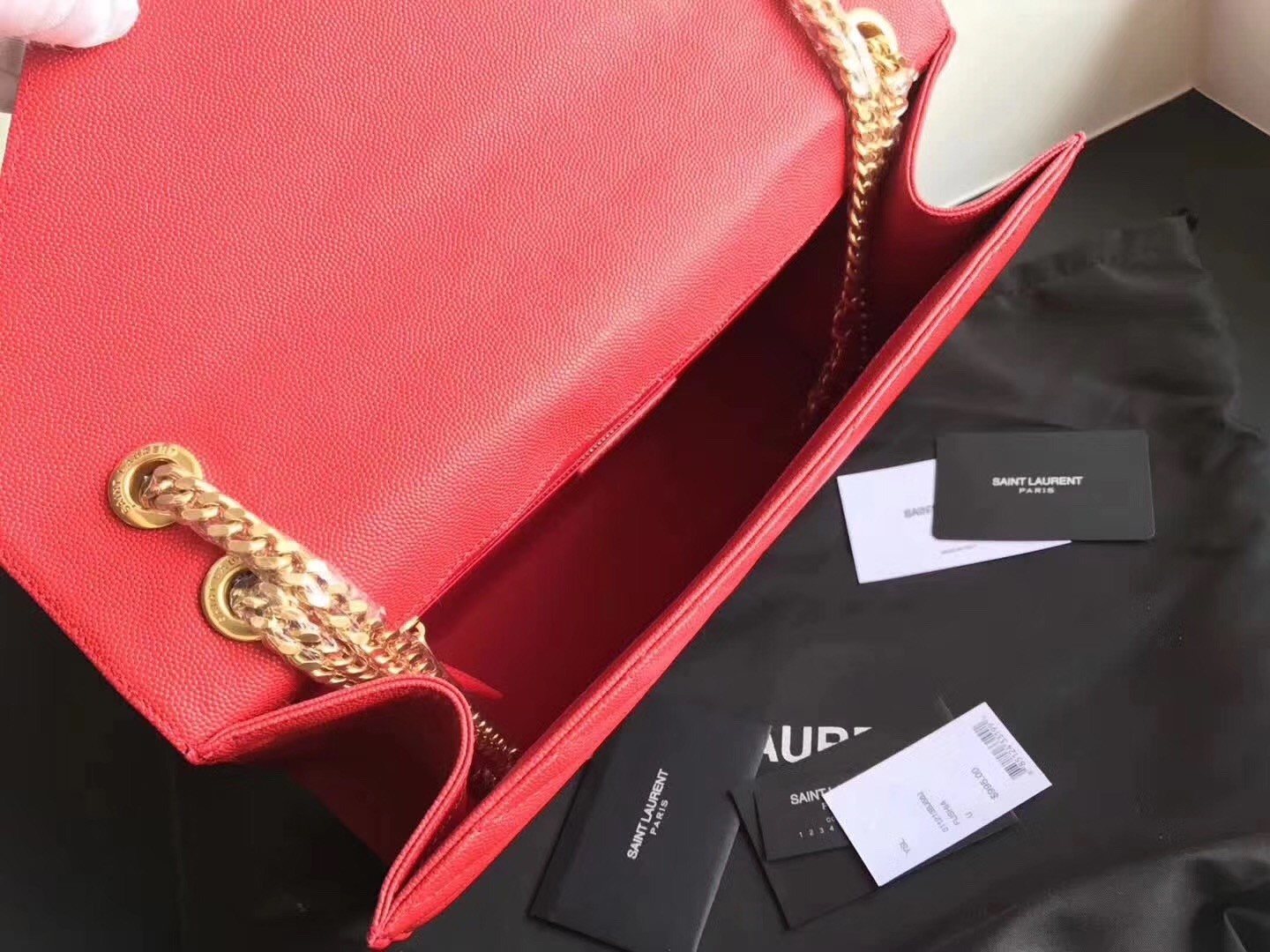 Sa**t Lau*nt envelope large bag in red quilted leather