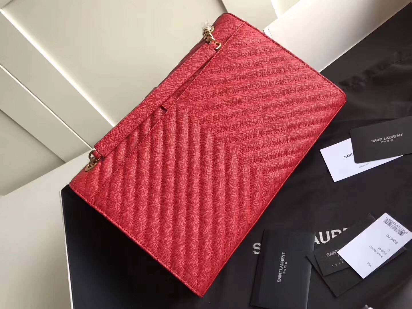 Sa**t Lau*nt envelope large bag in red quilted leather