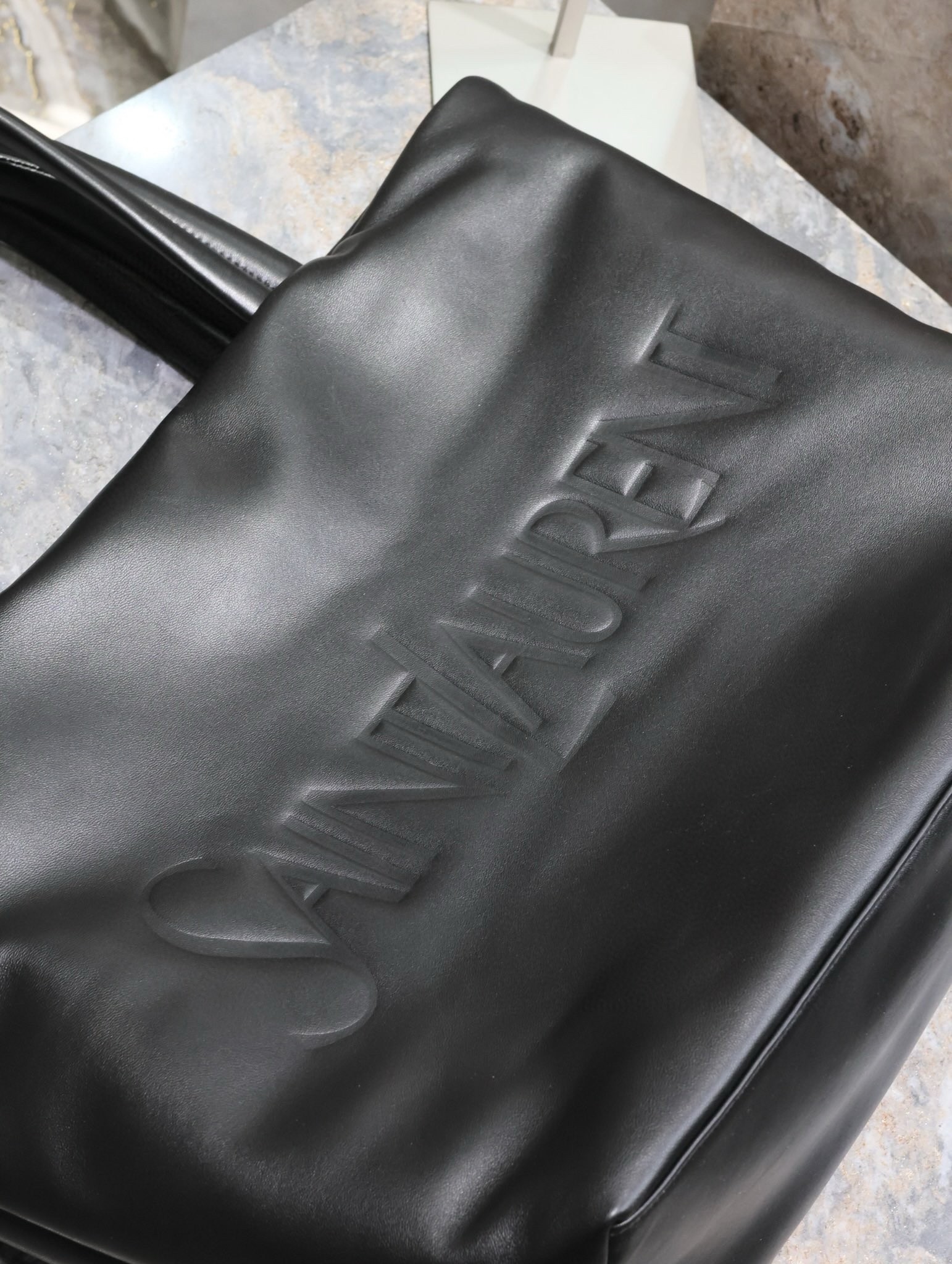 Sa**t Lau*nt wide puffer tote bag in black nappa lambskin