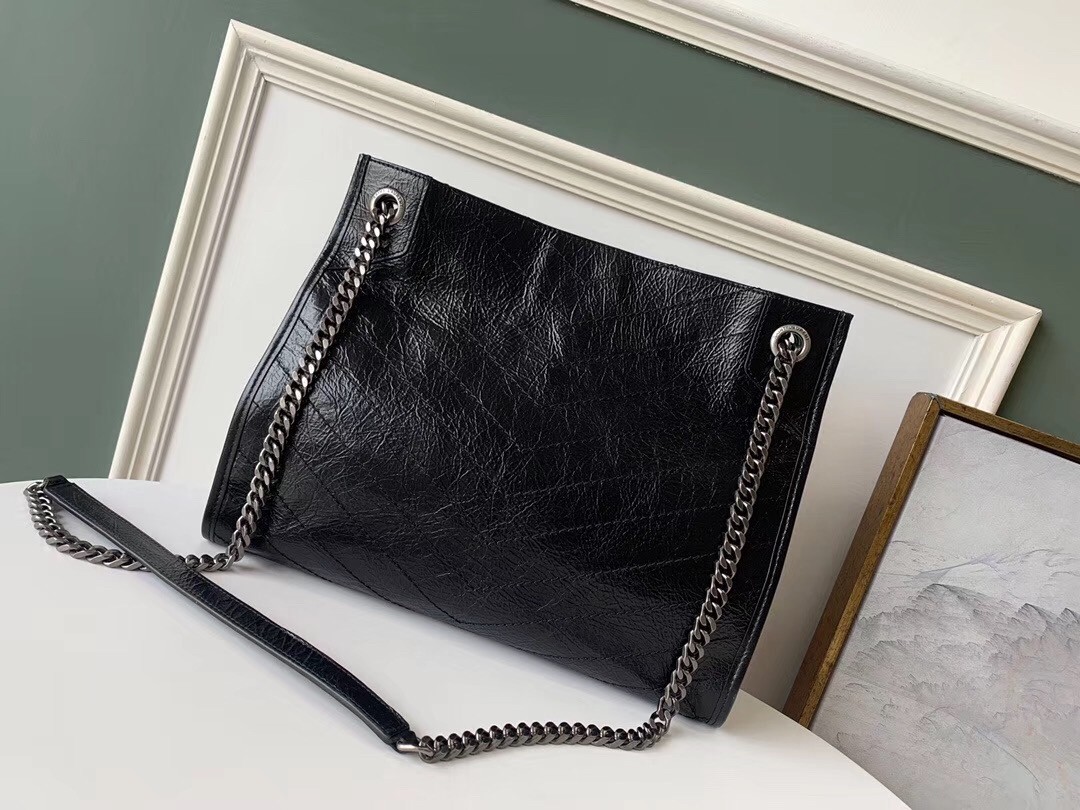 Sa**t Lau*nt medium niki shopping bag in black leather