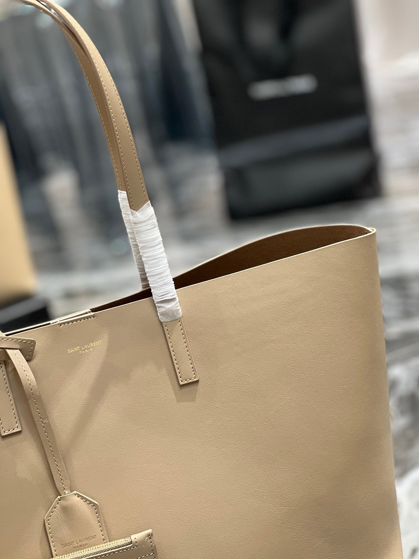 Sa**t Lau*nt shopping tote bag in beige leather