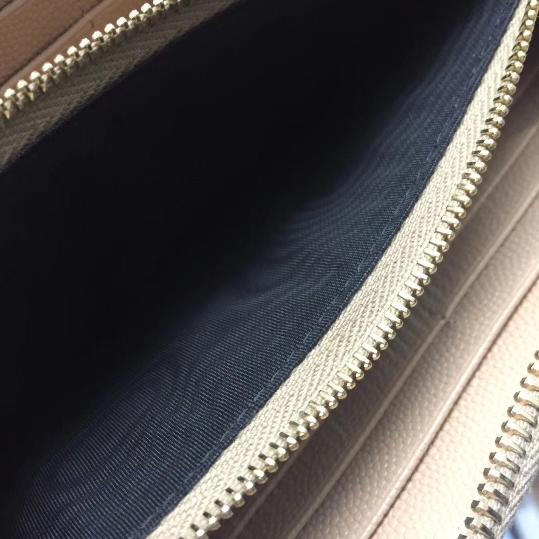 Sa**t Lau*nt monogram zip around wallet in powder grained leather